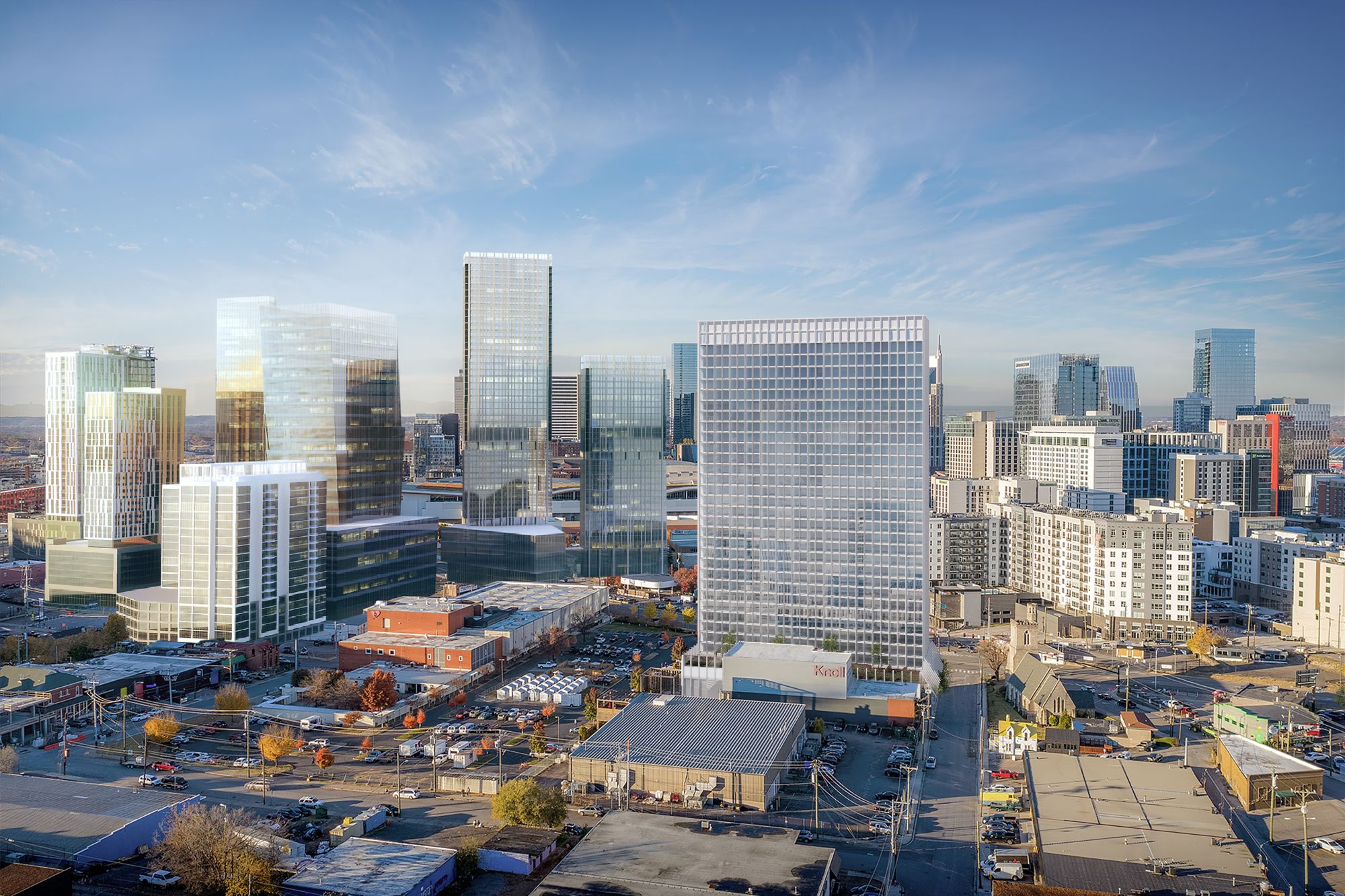 Aerial 3D rendering of a VeLa tower within a downtown skyline by day, showing its relationship to surrounding buildings and streets.